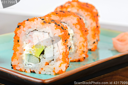 Image of California maki sushi with orange masago