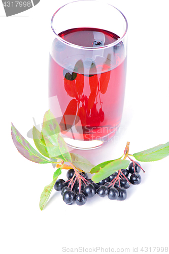 Image of Glass of aronia juice with berries