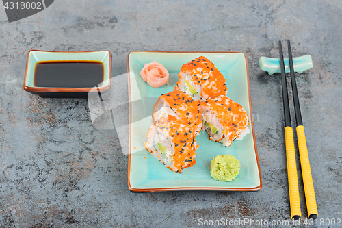 Image of Sushi rolls with masago. Top view.