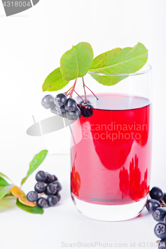 Image of Glass of aronia juice with berries