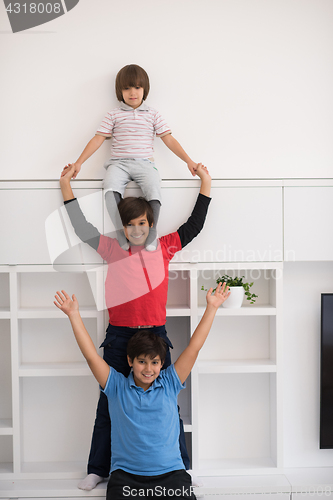 Image of young boys posing line up piggyback