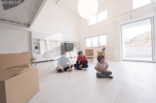 Image of young boys having fun on the floor