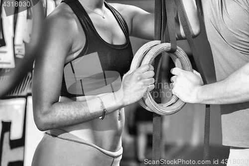 Image of Portrait of multiethnic couple  after workout at gym