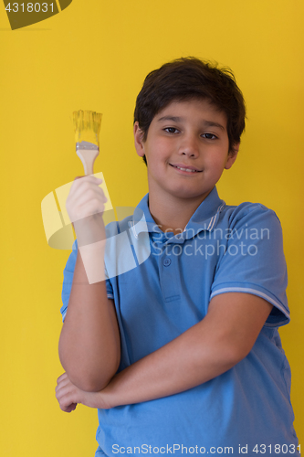 Image of Portrait of a happy young boy painter