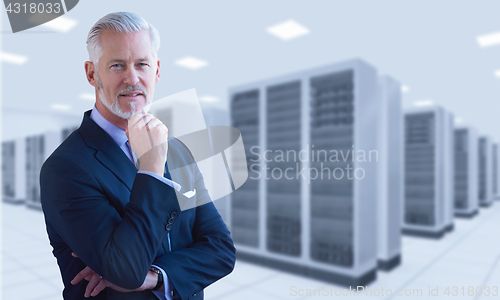 Image of Senior businessman in server room