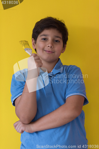 Image of Portrait of a happy young boy painter