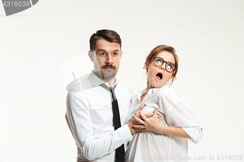 Image of The business man and woman communicating on a gray background