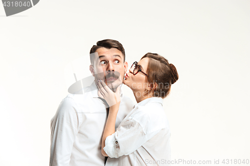 Image of The business man and woman communicating on a gray background