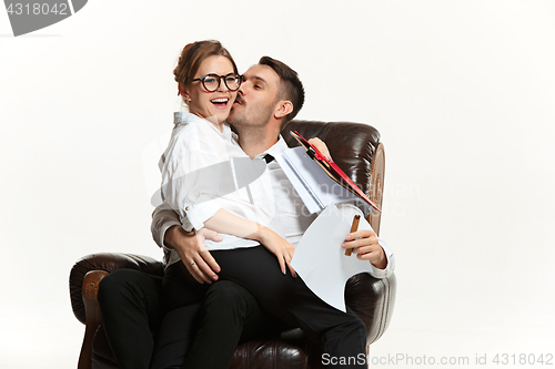 Image of The business man and woman communicating on a gray background