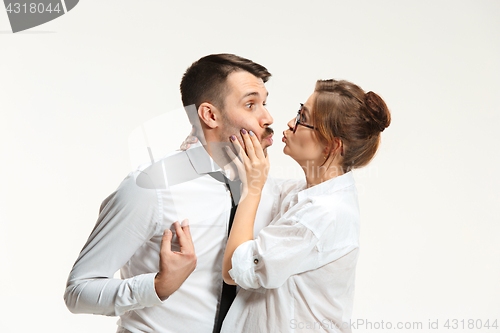 Image of The business man and woman communicating on a gray background