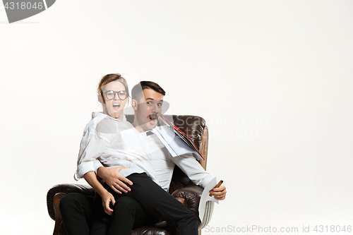 Image of The business man and woman communicating on a gray background