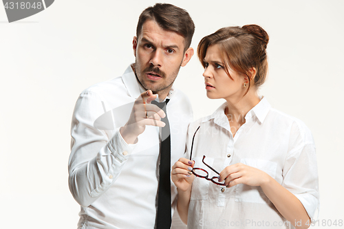 Image of The business man and woman communicating on a gray background