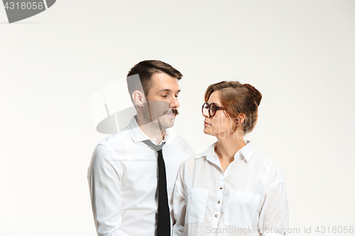 Image of The business man and woman communicating on a gray background