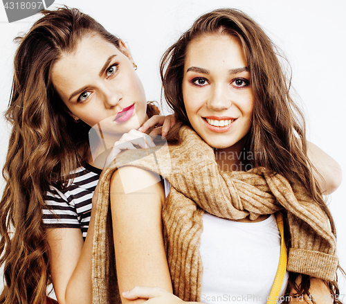 Image of best friends teenage girls together having fun, posing emotional on white background, besties happy smiling, lifestyle people concept close up