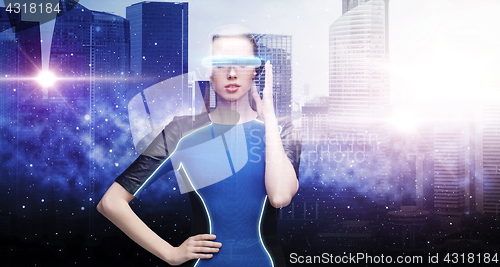 Image of woman in virtual reality glasses over space city