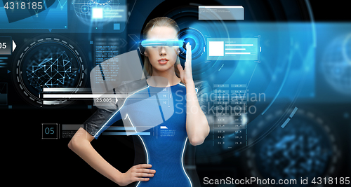 Image of woman in virtual reality 3d glasses with charts