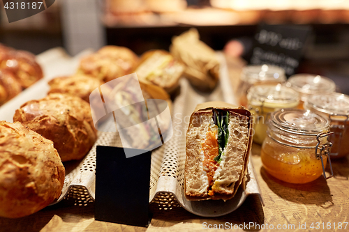 Image of bread and sandwiches with price at grocery store