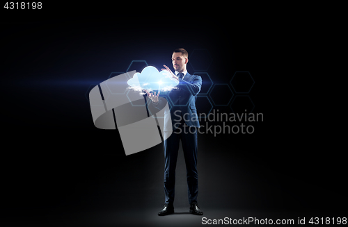 Image of businessman working with virtual cloud hologram