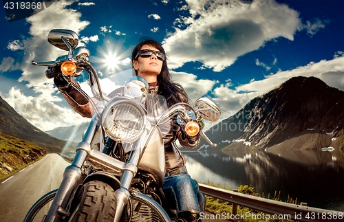 Image of Biker girl on a motorcycle