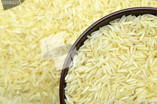 Image of White basmati rice with wooden bowl