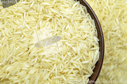 Image of White basmati rice with wooden bowl