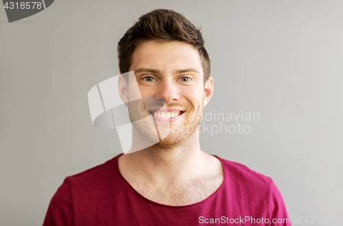 Image of portrait of happy smiling handsome young man