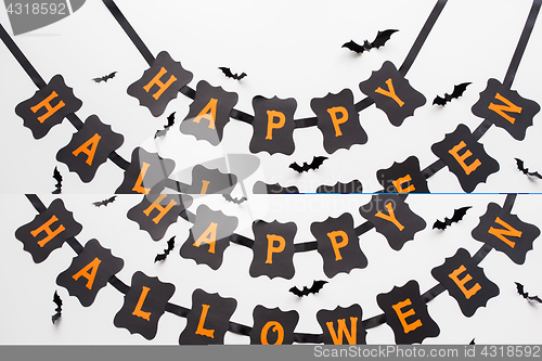 Image of happy halloween party garland decoration and bats