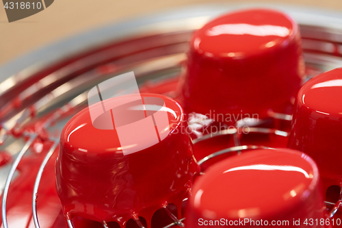 Image of mirror glaze cakes at pastry shop