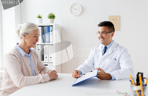 Image of senior woman and doctor meeting at hospital