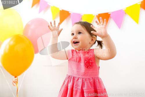 Image of happy baby girl on birthday party