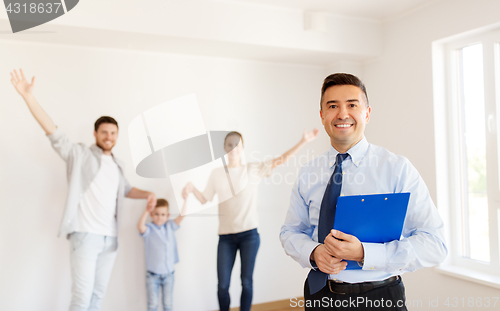 Image of realtor with clipboard and family at new home