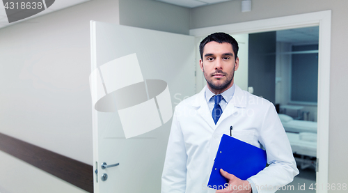 Image of doctor with clipboard at hospital