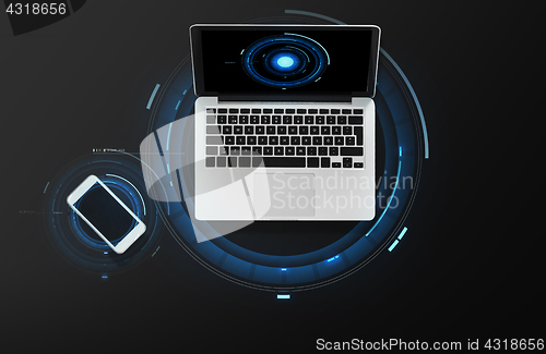Image of laptop computer and smartphone top view