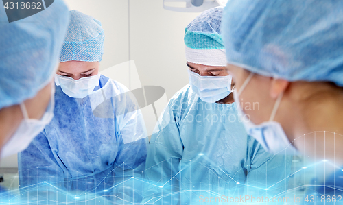 Image of group of surgeons in operating room at hospital