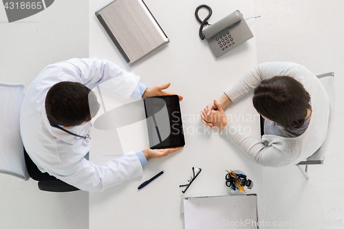 Image of doctor and young woman meeting at hospital