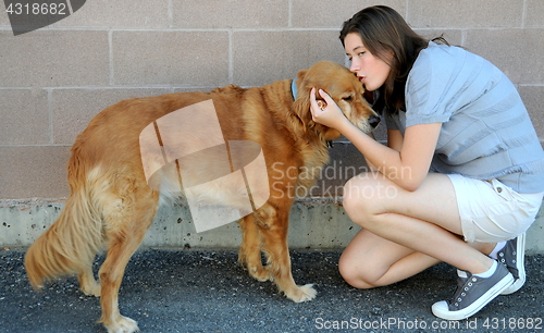 Image of Female and dog bonding.