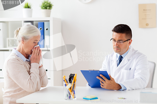 Image of senior woman and doctor meeting at hospital