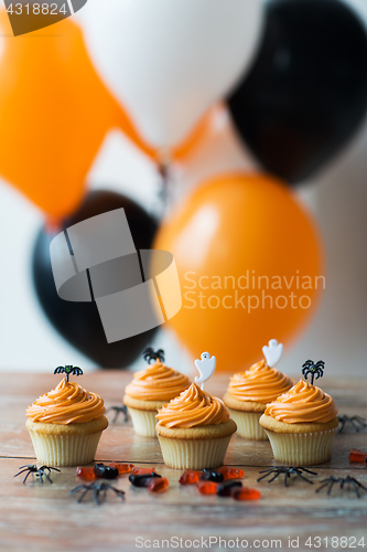 Image of halloween party cupcakes or muffins on table