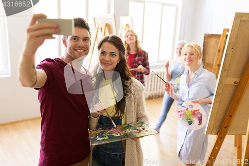 Image of group of artists taking selfie at art school