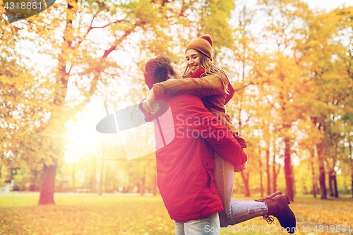 Image of happy young couple meeting in autumn park