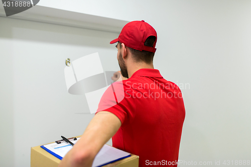 Image of delivery man with parcel box knocking door