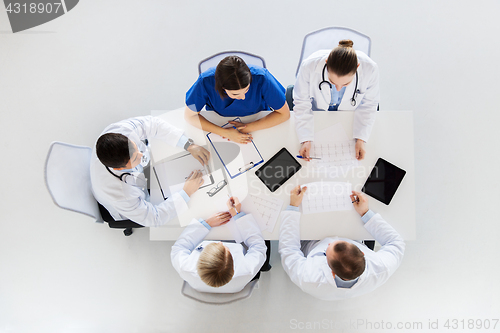 Image of group of doctors with cardiograms at hospital