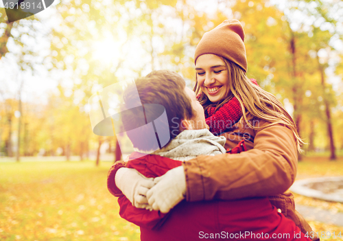 Image of happy young couple meeting in autumn park