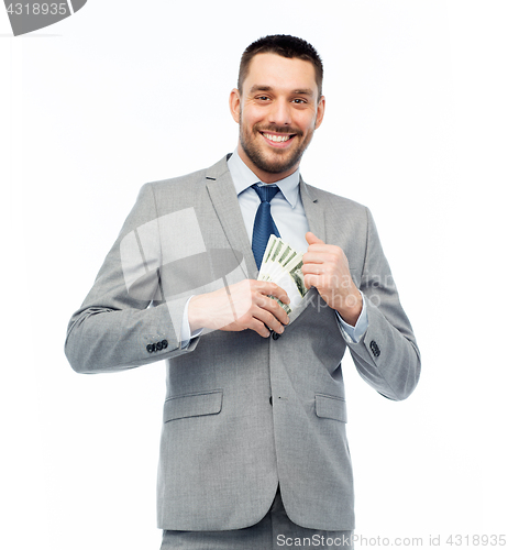 Image of smiling businessman with american dollar money