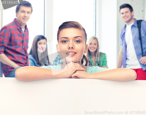 Image of woman with white blank board at school