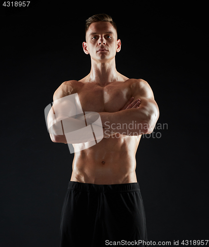 Image of young man or bodybuilder with bare torso