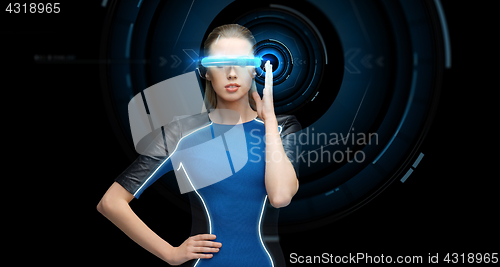 Image of woman in virtual reality 3d glasses with hologram