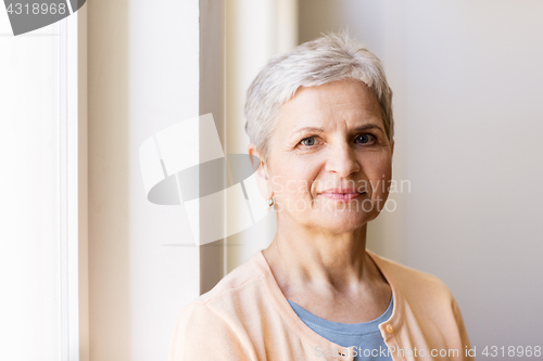 Image of portrait of happy smiling gray senior woman