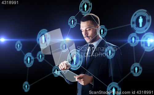 Image of businessman with tablet pc and network contacts