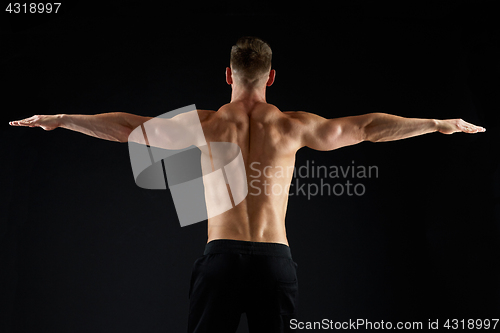 Image of young man or bodybuilder with bare torso